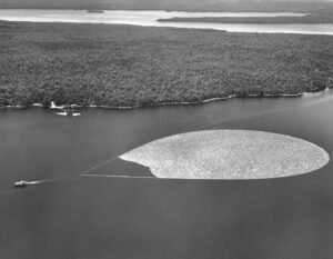 Aerial View of Boat Pulling Boom