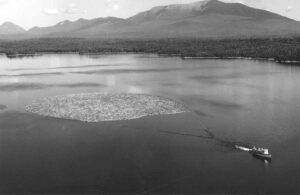Aerial View of a Boat Pulling Boom on Pemadumcook Lakes