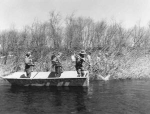 Three Men Working on a Boat at Seboomook