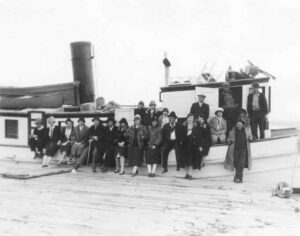 People in Front of a Boat in the 1920's
