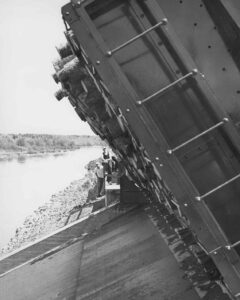 Boxcar Dumping Pulp in the River