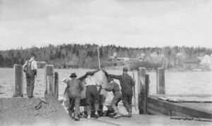 Crew Putting a Boat in the Water