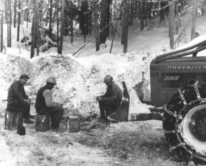 Crew Taking a Break by a Skidder