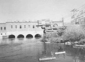 Dumping Wood From a Truck at Dolby Dam in the 1940s