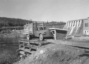 Dumping Wood From a Truck at Dolby Dam in the 1940s