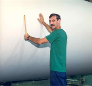Papermaker Beating a Roll of Paper in the East Millinocket Mill