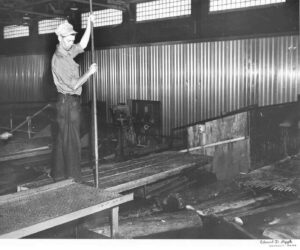 Poling Wood in the East Millinocket Mill Grinder Room