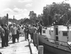 Festive Crowd Looking at a Boat