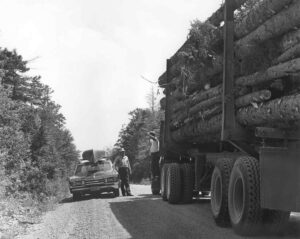 Log Truck Driver Talking to a Fisherman