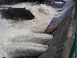 Looking Down Ripogenus Dam With Open Deep Gates