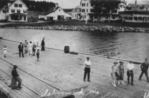 People on a Wharf at Seboomook House at Mooshead Lake