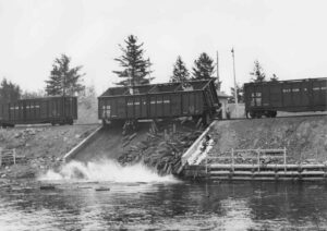 Boxcars Dumping Pulp in the River