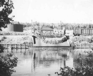 Boxcars Dumping Pulp in the River