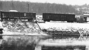 Boxcars Dumping Pulp in the River