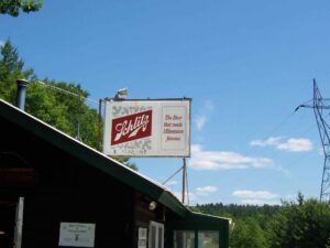Schlitz Sign on Top of Abol Store