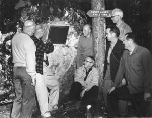 Screw Auger Falls Group Looking at a Plaque