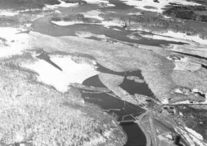 Arial View of Stone Dam and Quakish Lake Full of Wood