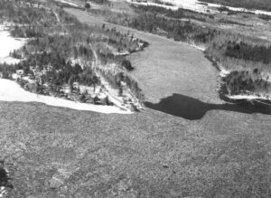 Arial View of Stone Dam and Quakish Lake Full of Wood