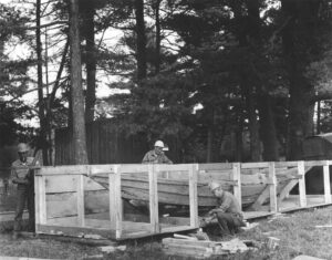 Three Men Crating a Boat