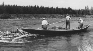 Three River Drivers in a Boat