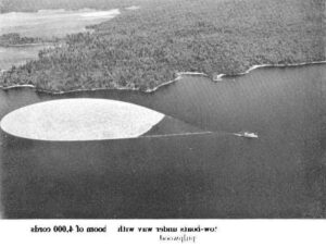 Aerial View of a Tug Boat Pulling Boom