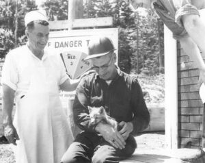 Woodlands Cook and a Forester Holding a Pet Fox