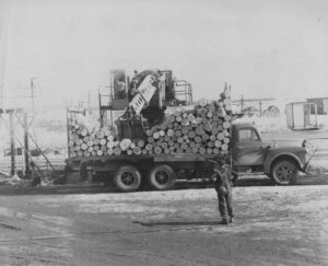 Unloading 4' Logs From a Truck with a Gradeall in the 1960's