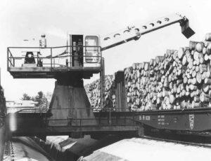 Unloading Wood with a Gradeall