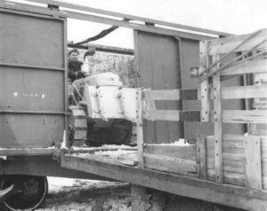 Unloading a Tractor from a Train to a Truck