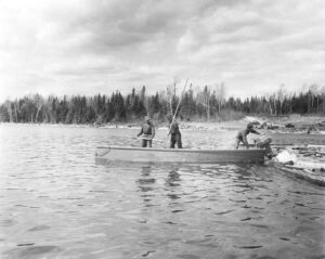 River Drivers with Outboard Motor Boat in the 1950's