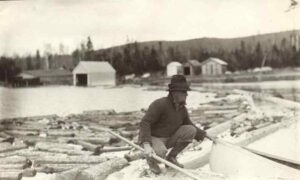 Man on a Boom Holding his Boat